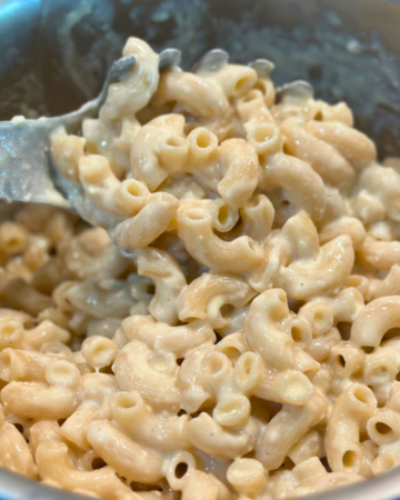 pot of gluten free mac and cheese with a spoon