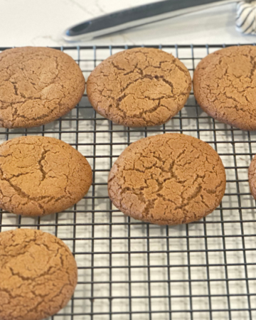 molasses cookies on a metal cooling rack